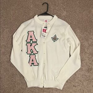 White Cardigan with AKA Logo